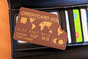 Photo of a credit card made from chocolate, with a bite out of one corner