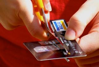 Photo of a credit card being cut up