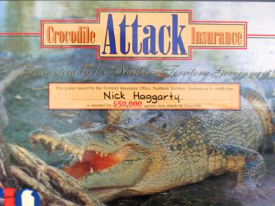 Photo of my laminated crocodile attack insurance certificate.