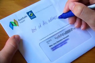 A photo of an envelope with someone writing “not at this address” on the front