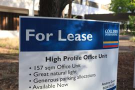 A photo of a real estate’s for lease sign