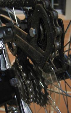 A close up photo of the gears on a bicycle