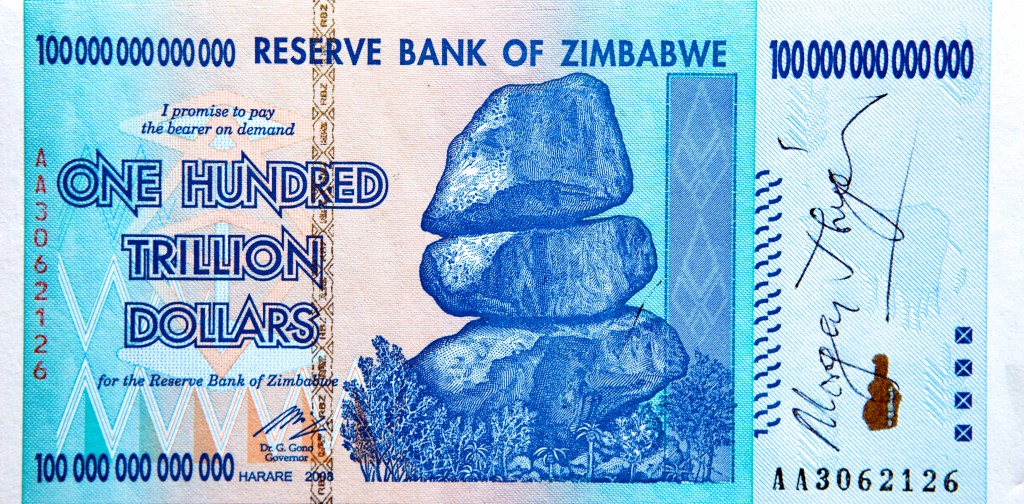 Photo of a Zimbabwean banknote for the amount of one hundred trillion dollars. It has been signed by Zimbabwe Prime Minister Morgan Tsvangirai.